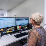 FL Registered Agent working in office at her desk.