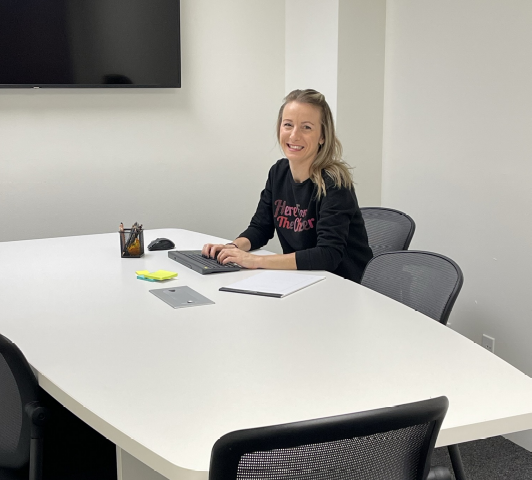 Local staff member working in conference room